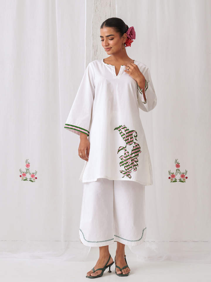 White Short Kurta With Embroidery Paired With Matching Pants With Curved Hemline