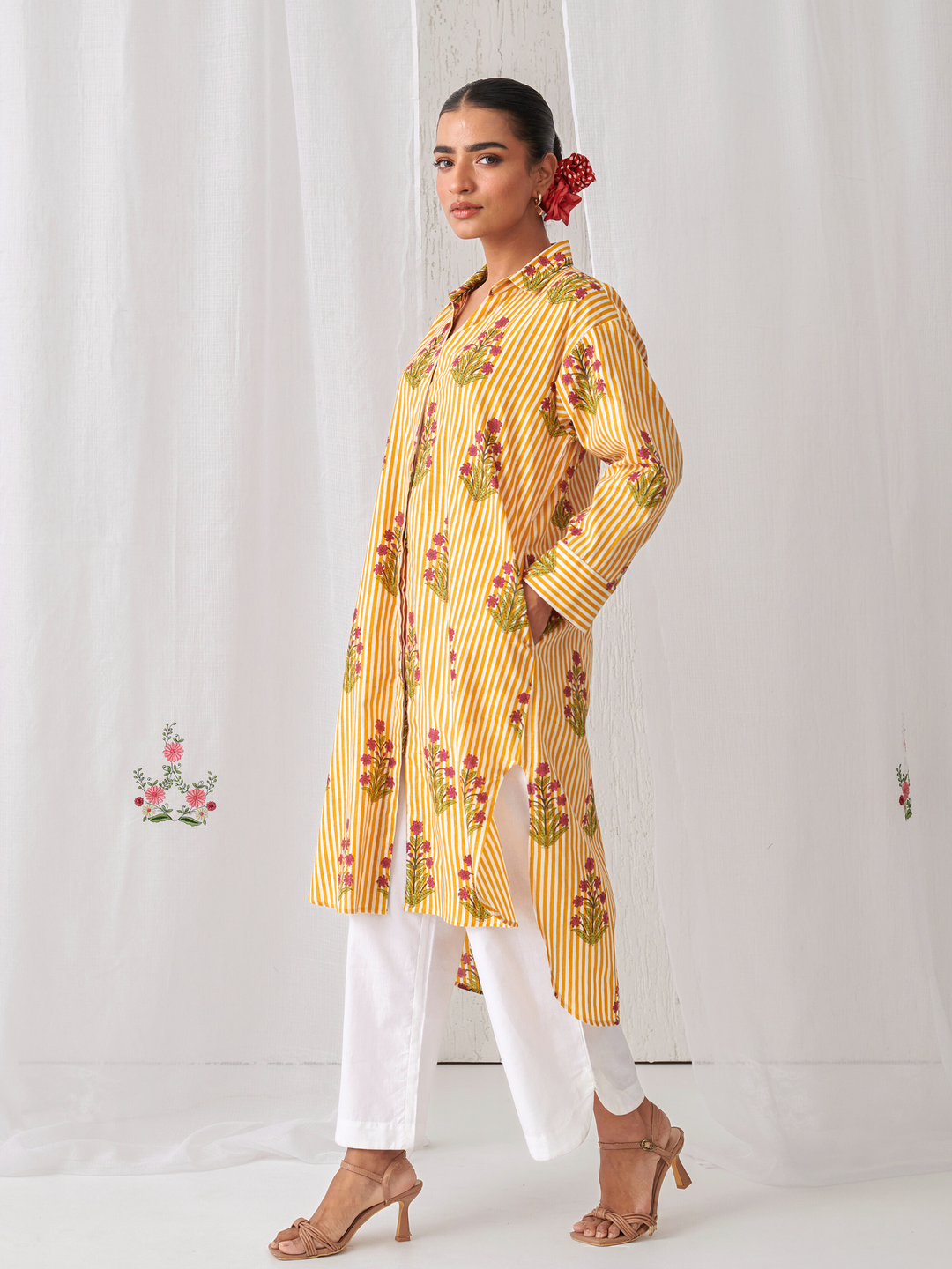 Yellow  Floral Shirt Style Kurta Paired With Curved Hem White Pants